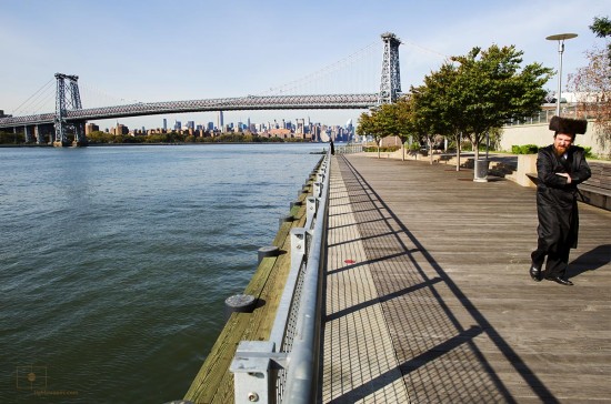 Hassidic Man with East River and Williamsburg Bridge, Williamsburg, New York City
