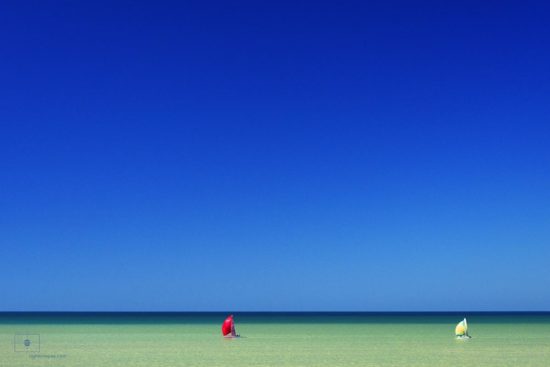 Red and Yellow Sailboats with Spinnakers on the Gulf of Mexico, Naples, Florida