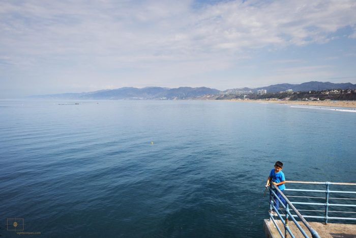 Boy in Blue Fishing from Santa Monica Pier, Santa Monica, California