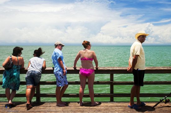 People Standing by the Rail of the Naples City Pier, Naples, Florida
