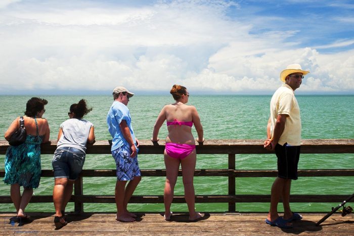 People Standing by the Rail of the Naples City Pier, Naples, Florida
