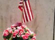 Bouquet of Red and Pink Flowers with an American Flag and Rosary Beads, Lafayette Cemetery No 1, New Orleans