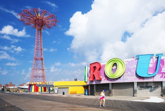 Coney Island, New York – Jogger on Boardwalk Coney Island Boardwalk with Jogger and Parachute Drop, Brooklyn, New York