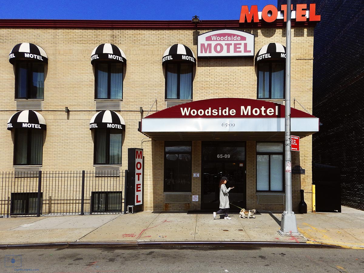 Woman Walking Dog while on Phone at Woodside Motel - Woodside, Queens, New York City