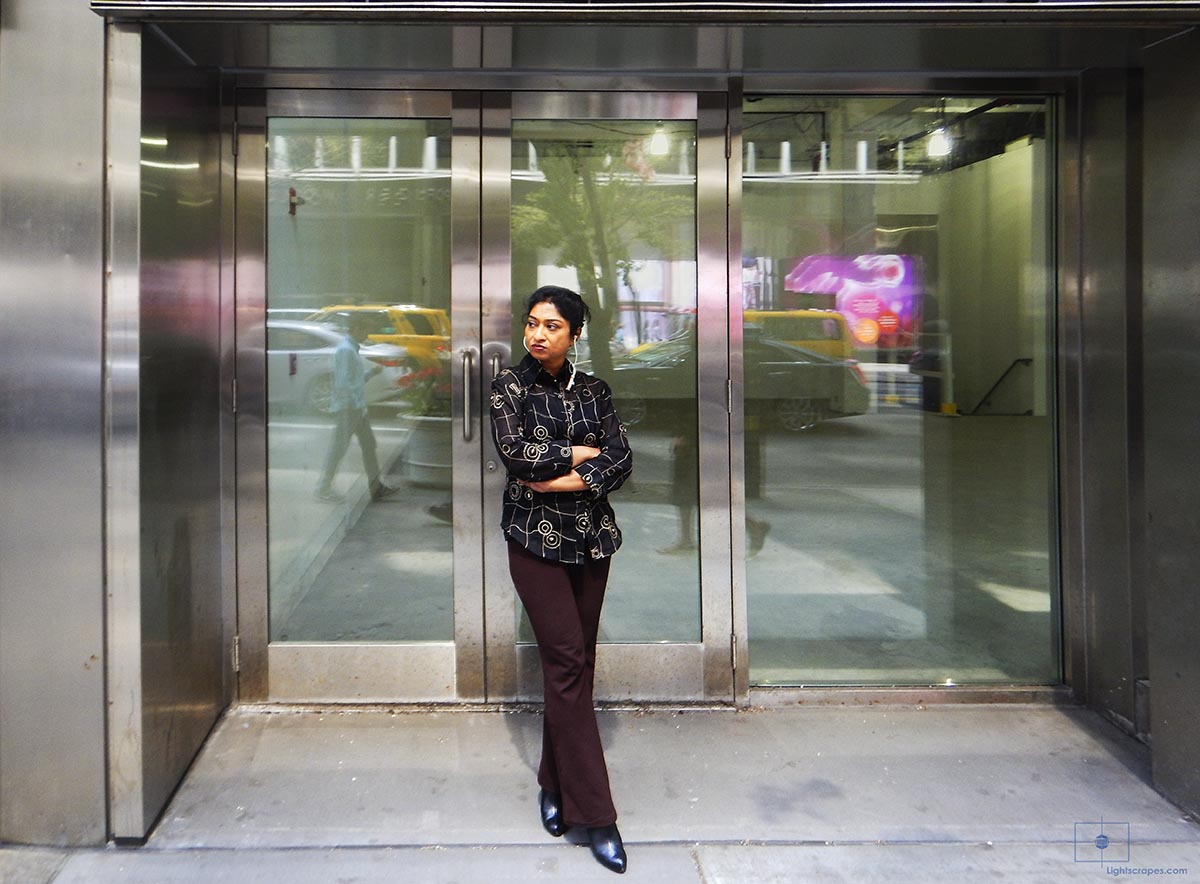 Woman with Earphones in Maroon and Brown - Midtown, New York City
