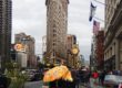Tourists Women under a Klimt Umbrella with Flatiron Building - Flatiron District, New York City