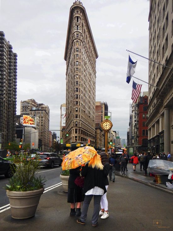 Tourists Women under a Klimt Umbrella with Flatiron Building - Flatiron District, New York City
